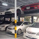 Two-level intelligent parking system efficiently storing multiple cars in a covered garage, demonstrating space-saving intelligent parking solutions for urban areas