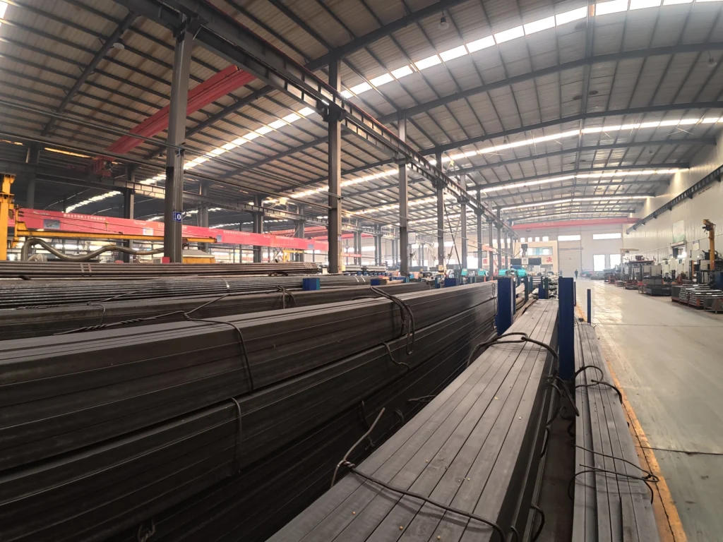 Qingdao Shin Innovation Technology Co., Ltd. Workshop Raw Steel Profiles & Material Storage Area